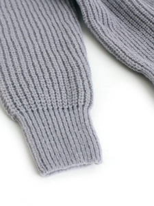 Women's knit cardigan sleeve detail with ribbed cuffs in an elegant grey purple hue