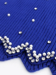 Blue ribbed knit tank top with pearl and rhinestone embellishments and wavy edge