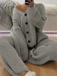 Close-up of grey ribbed knit loungewear set featuring V-neck cardigan with black buttons