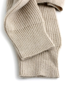 Detailed close-up of oatmeal rib knit cuffs showing fine stitching and texture