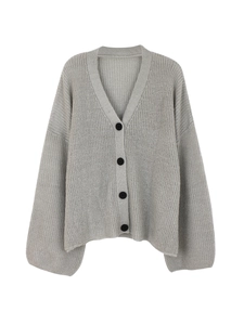 Detail of light gray knit cardigan with V-neckline and four black buttons
