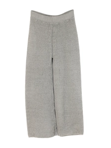 Detail of grey knitted wide-leg pants featuring vertical texture and elastic waistband