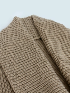 Women's long knit cardigan in camel brown featuring thick ribbed texture and open front