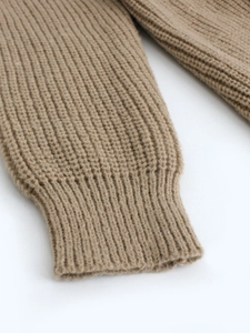 Close-up of khaki long-sleeve knit cardigan featuring detailed ribbed elastic cuffs