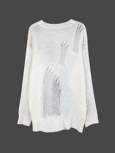 Haut en maille blanche à manches longues avec découpes évidées de style avant-garde
