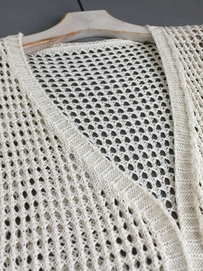 Elegant ivory hollow crochet knit cardigan with V-neck design for beach or summer wear