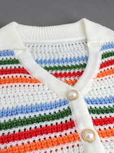 Knit set featuring horizontal stripes and pearl buttons on a white textured polo shirt