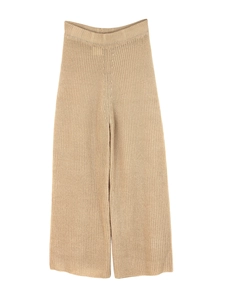 Detail of high-waist khaki knit wide-leg trousers with elastic waistband and ribbed texture