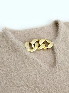 Elegant beige long sleeve knitted sweater with hollow neckline and gold chain detail