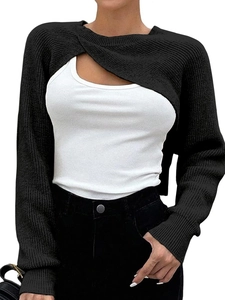 Detailed knit texture of a black long sleeve cropped shrug with crossover front design