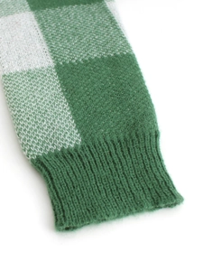 Women's green checkered knit cardigan with ribbed cuffs and soft fuzzy texture