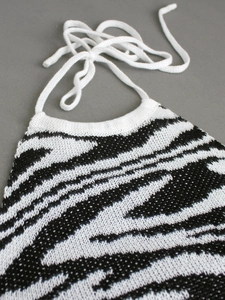 Slim fit knit halter top featuring black and white zebra pattern with white neck ties