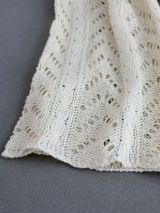 Elegant white pointelle knit long cardigan with intricate cable knit textures for women