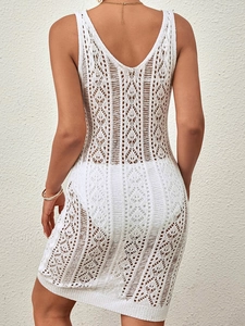 White sleeveless crochet mini dress with hollow out knit patterns for summer beach cover-up