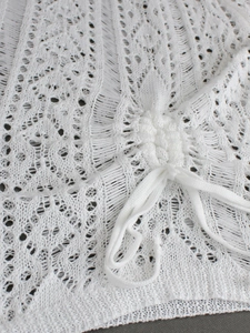 White crochet knit sleeveless beach cover-up dress with intricate hollow out geometric patterns