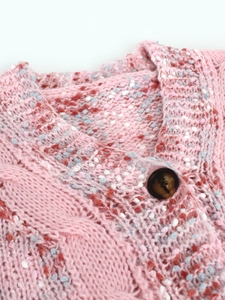 Pink chunky knit cardigan sweater with tortoiseshell buttons and colorful flecked texture