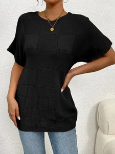 Detail of black hollow-out knit texture on women's short sleeve round neck sweater