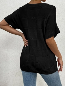 Back view of women's short sleeve knit top showing black checkered hollow texture