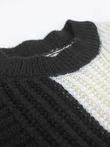 Women's crewneck long sleeve cable knit sweater in black and white contrast design