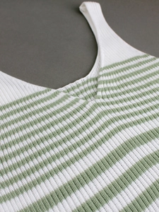 Green and white striped knit V-neck camisole dress with ribbed texture on gray background
