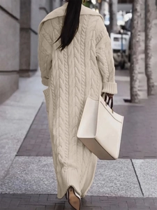 Women's long chunky cable knit cardigan in cream white with large lapels and pockets