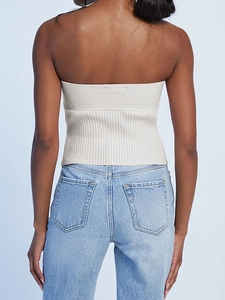 White ribbed knit tube top for women paired with classic light blue denim jeans