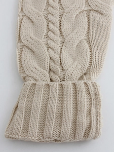 Chunky cable knit long cardigan in oatmeal white featuring thick texture and ribbed cuffs