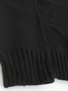 Black long sleeve V-neck knit sweater featuring elastic ribbed cuffs and hem details