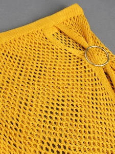 Detail of yellow knit crochet beach set featuring mesh texture and silver metal ring