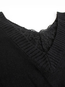 Close-up of V-neckline featuring elegant black lace insert and floral embroidery detail