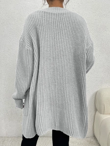 Rear view of long sleeve grey knit cardigan showing thick knit texture and relaxed fit