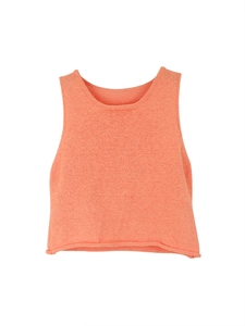 Detailed flat lay of coral knit sleeveless vest showing smooth crew neck and ribbed texture