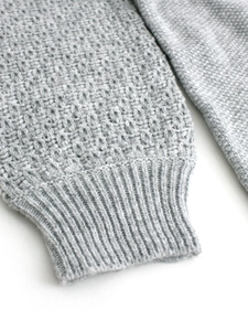 Slim fit crewneck knit sweater in light grey featuring textured waffle weave cuffs