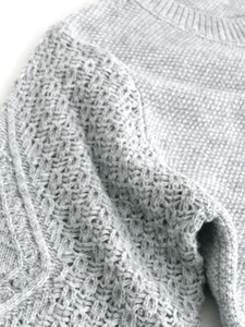 Slim fit light gray knit sweater with round neck and hollow sleeve texture for women