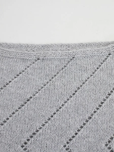 Elegant light gray knit sweater with long sleeves and hollow-out detailing for women