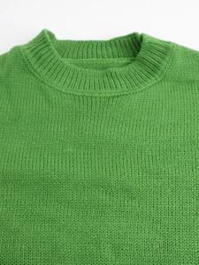 Classic green crewneck knit sweater featuring ribbed collar and soft textured fabric detail