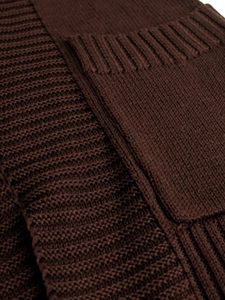 Detail shot of the knitted fabric texture and ribbed patch pocket on this dark brown cardigan