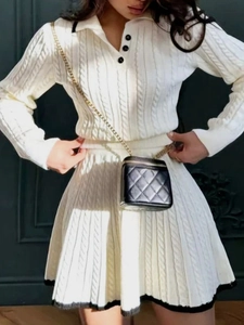 Elegant white knit set with long sleeve polo top and pleated skirt featuring black trim