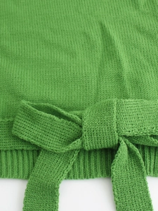 Women casual loose knit sweater with bow tie detail and ribbed texture in green