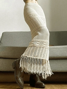 Women's bohemian crochet knit maxi skirt with hollow texture and fringe hem detail