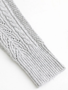 Close-up of light grey cable knit long sleeve dress featuring premium ribbed cuffs