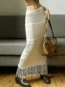 Bohemian crochet knit maxi skirt with hollow texture and tassel hem in cream white