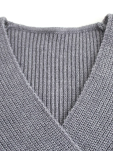 Grey V-neck knit dress with ribbed texture and long sleeves for women stylishly displayed