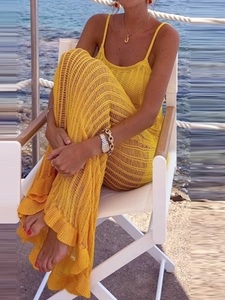 Vibrant yellow knit hollow-out maxi dress with ruffle hem for summer beach vacations