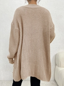 Detailed back view of long cable knit cardigan in oatmeal beige with ribbing texture