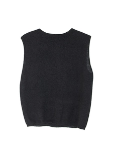 Close-up of black knitted sleeveless vest with crew neck and dense ribbed texture