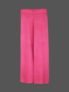 Detail of hot pink crochet knit pants featuring hollow-out texture and elastic waistband