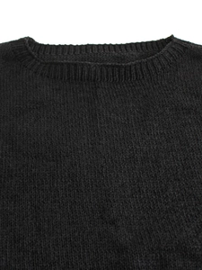 Close-up of the ribbed crew neck detail on a classic black knitted vest for women