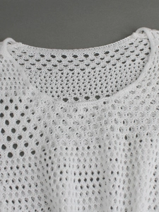 White sleeveless knit tank top with delicate hollow crochet mesh pattern and round neck