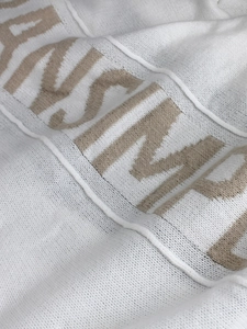 White knit long sleeve hooded cardigan featuring light brown jacquard letter patterns